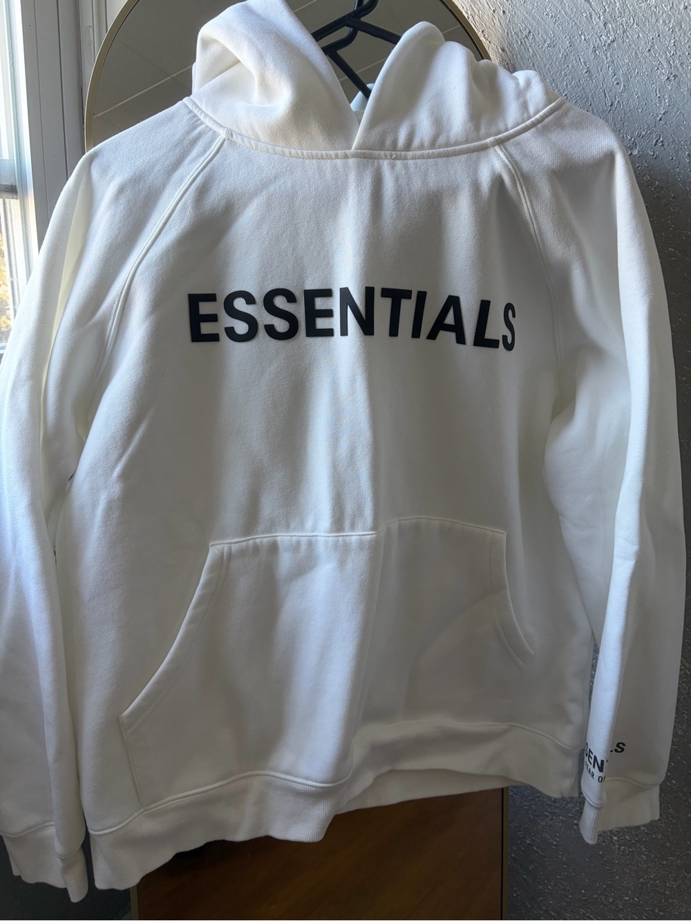 Essentials White Hoodie with Black Chest Print